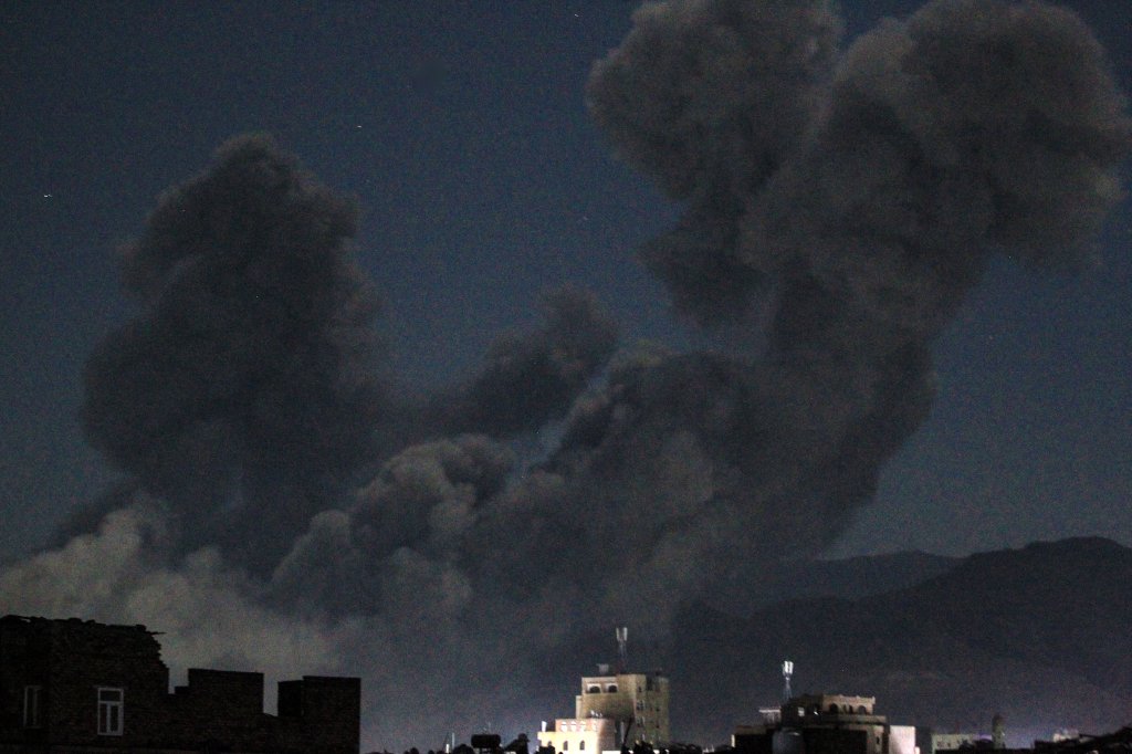 TOPSHOT - A plume of smoke billows during a US strike on Yemen's Huthi-held capital Sanaa early on March 16, 2025. The first US strikes against Yemen's Huthis since President Donald Trump took office in January killed at least 31 people, the rebels said on March 16, as Washington warned Iran to stop backing the group. (Photo by Mohammed HUWAIS / AFP) (Photo by MOHAMMED HUWAIS/AFP via Getty Images)